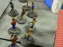 They are standing on my new cobblestone street bases. The ground is uneven because I didn't have enough space on the table and I just plonked these on top of some other crap. I really need to clean my workspace...