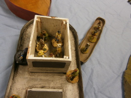 As defenders huddle in the cabin, boarders jump onto the ship.