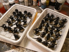 Drying in the racks. Actually, they need a final whiff of varnish to protect the penwork I did for the symbols.