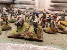 A pair of of armored war dogs from I believe Ral Partha. Their handler is in the second batch.