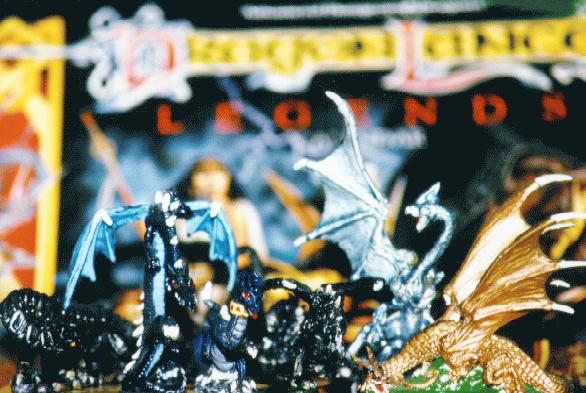 Dragons posing in front of a DragonLance calendar