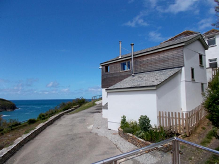 Holiday flat above a storeroom with balcony views out to sea. Port Isaac, Cornwall.