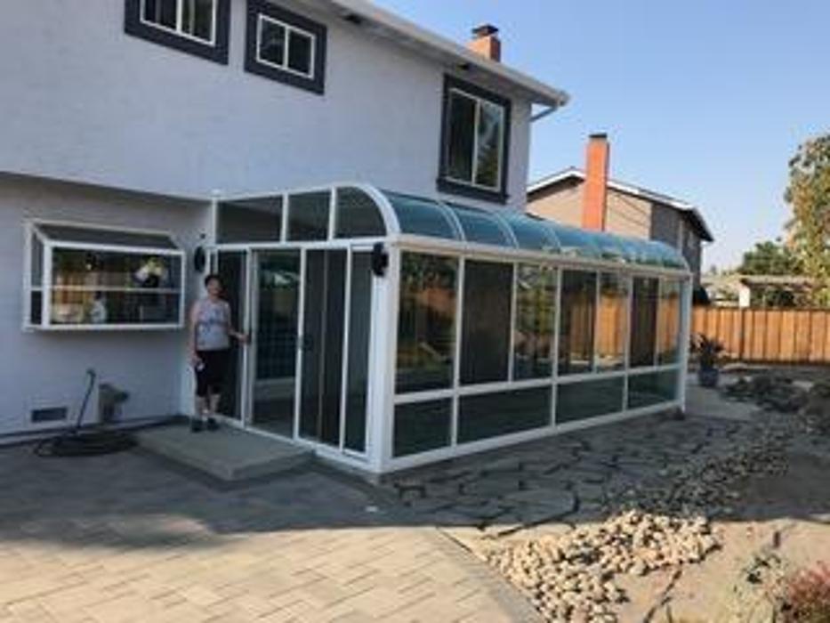 GDM Construction, Four Seasons Sunrooms, very happy client, ConservaGlass windows, ConservaGlass roof system, reinforced concrete foundation