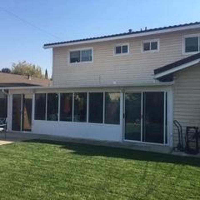 Four Seasons Sunrooms, GDM Construction, Series 230 Sun and Shade Studio Sunroom, Patio sliding door, solid lower transoms, ConservaGlass windows