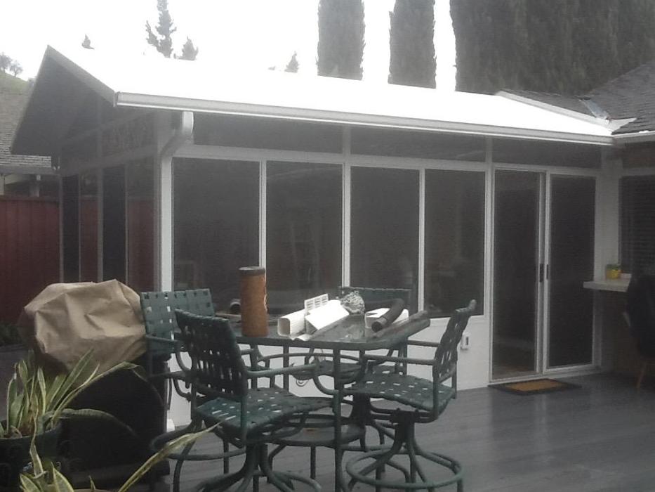 GDM Construction, Four Seasons Sunrooms, completed project, ConservaGlass upper transoms, ConservaGlass operable windows, ConservaGlass trap glass, solid lower transoms, deck project, aluminum gutters and downspouts