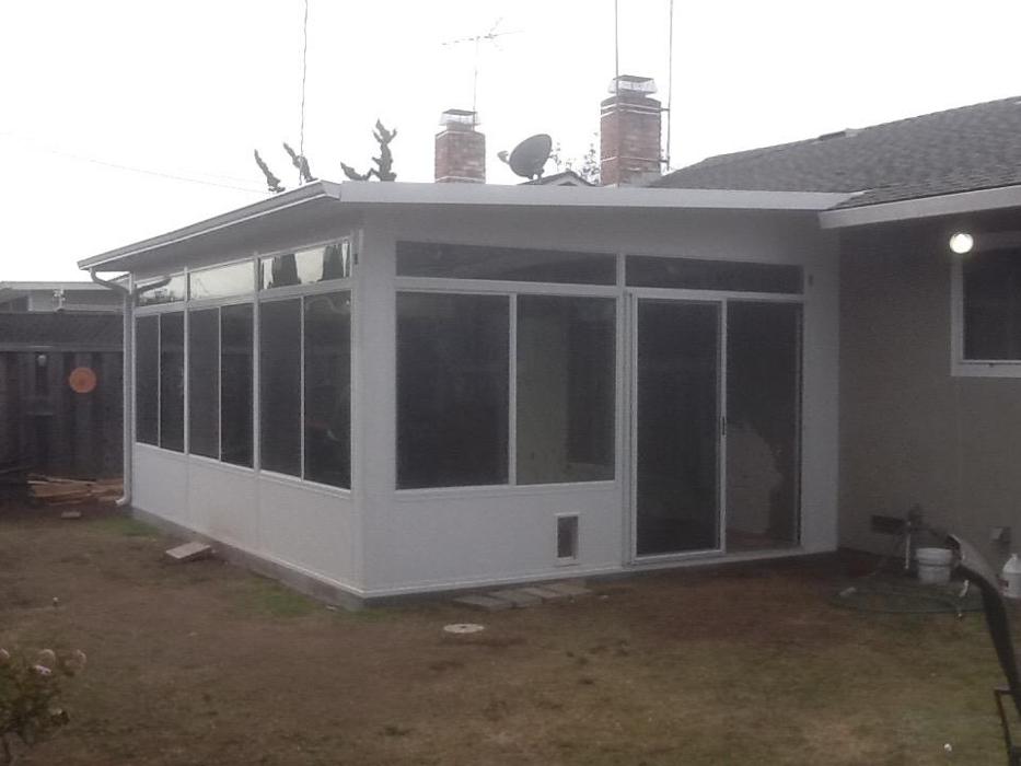 GDM Construction, Four Seasons Sunrooms, Studio Sunroom, ConservaGlass upper transoms, ConservaGlass operable windows, solid lower transoms, ConservaGlass patio sliding door, doggie door
