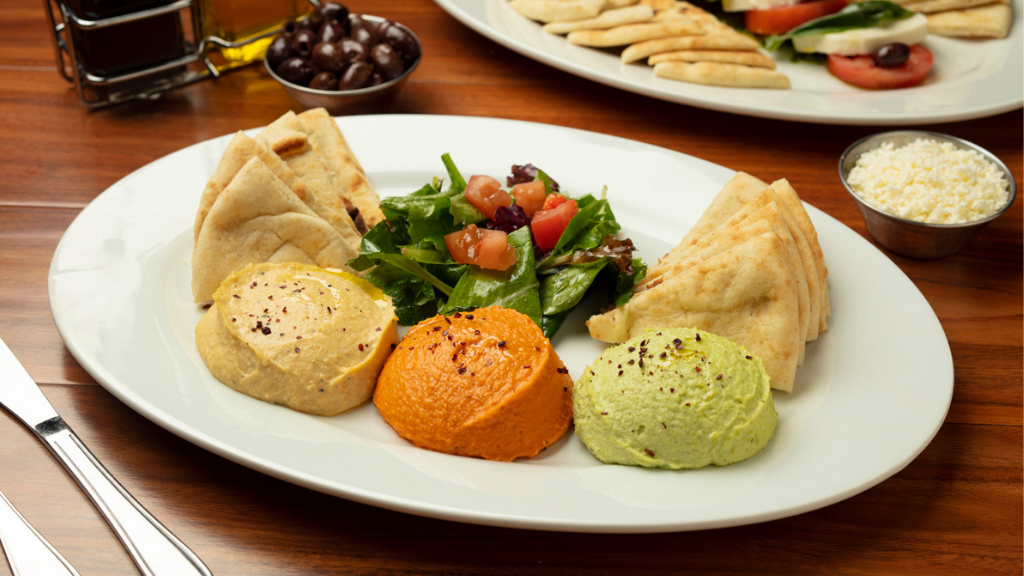 Hummus Trio (Edamame, Garbanzo, Beets): Blended with chopped garlic, olive oil, & freshly squeezed lime juice