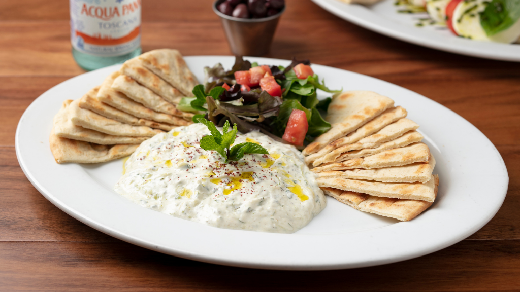 Tzatziki Appetizer: Made with grated cucumbers, Greek yogurt, fresh dill, parsley, & fresh chopped garlic