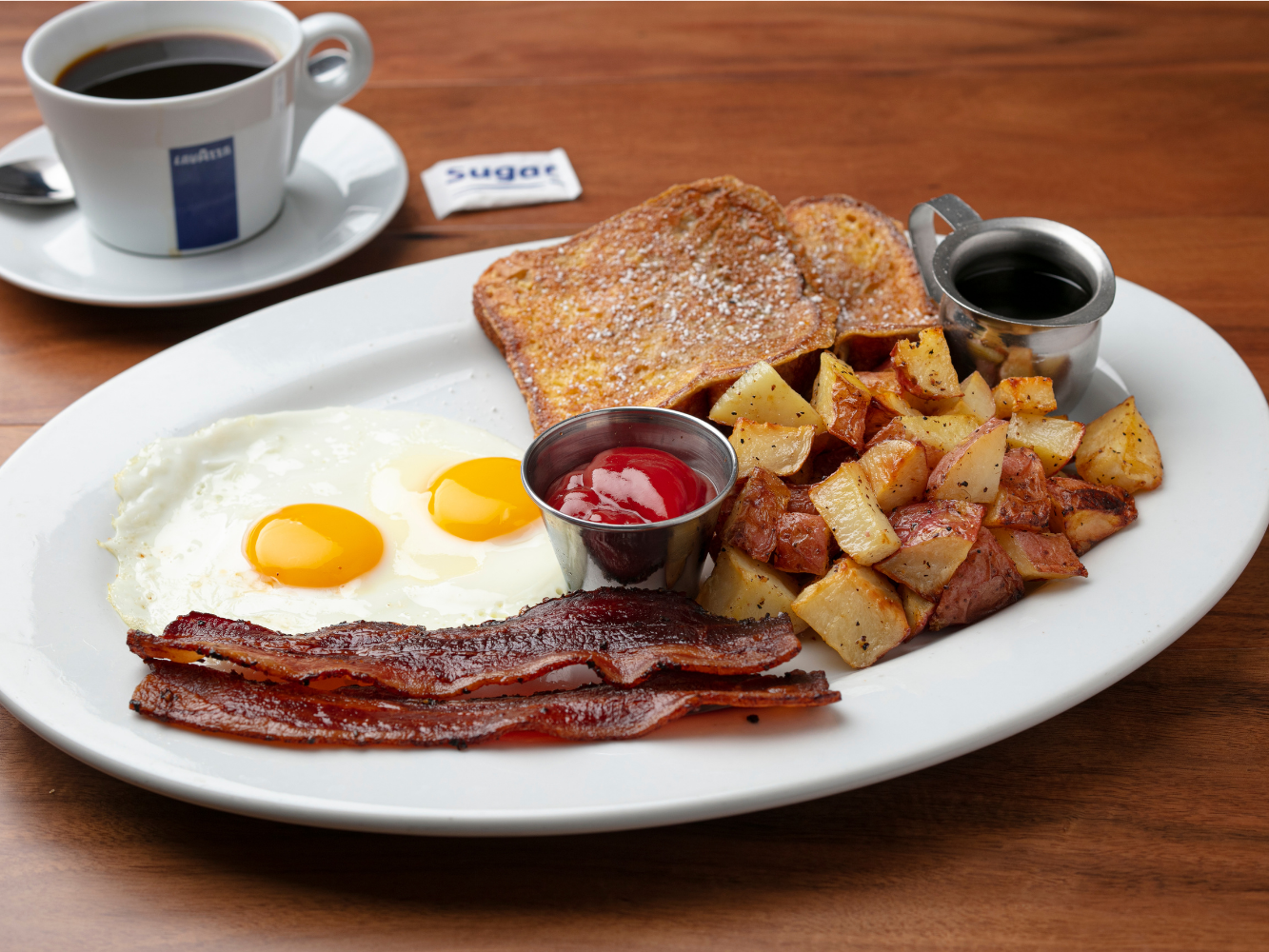 Breakfast Combo (2 French Toast, 2 Eggs Any Style with Applewood Smoked Pepper Bacon)