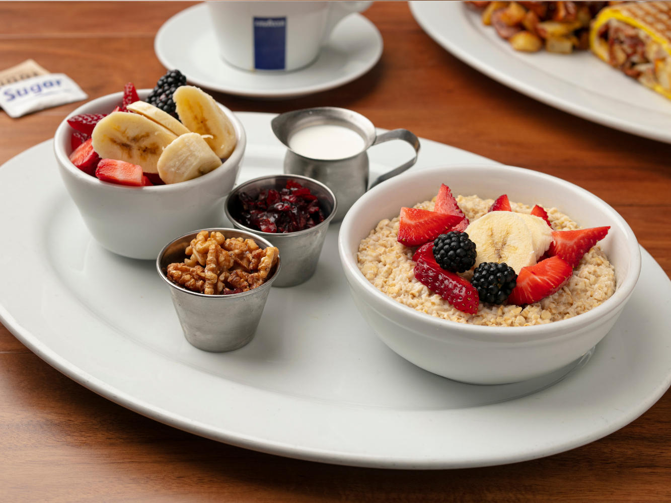 Oatmeal (Milk, Walnuts, Raisins, Brown Sugar, with Strawberry and Banana Cup).