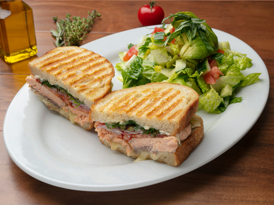 Salmon Brie Panini (Grilled Sustainable Fresh Atlantic Salmon, Melted Brie, Roma Tomatoes, Fresh Dill, Capers & Red Onions)