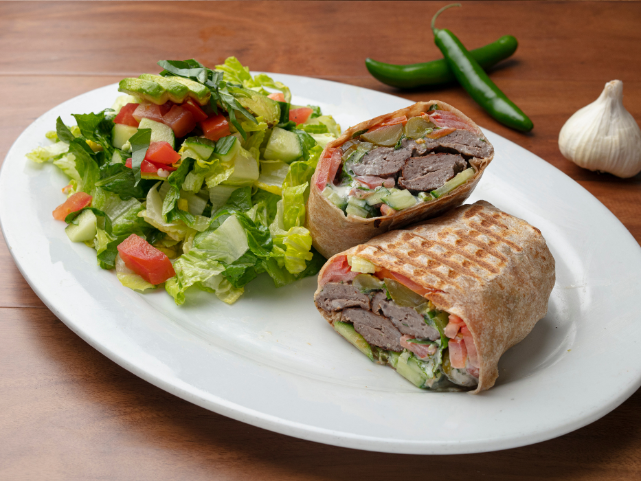 Koobideh Wrap: Ground ABF Beef Kabob, Tzatziki, Romaine Lettuce, Tomato, Cucumber, Pickle with Fresh Mint, Basil in a Tortilla