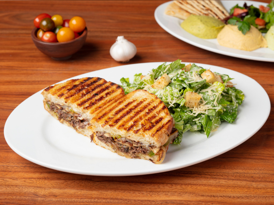 Steak Panini (Flat Iron Steak with Grilled Mushrooms, Bell Peppers, Onions, Persian Pickles, & Melted Smoked Mozzarella Cheese)