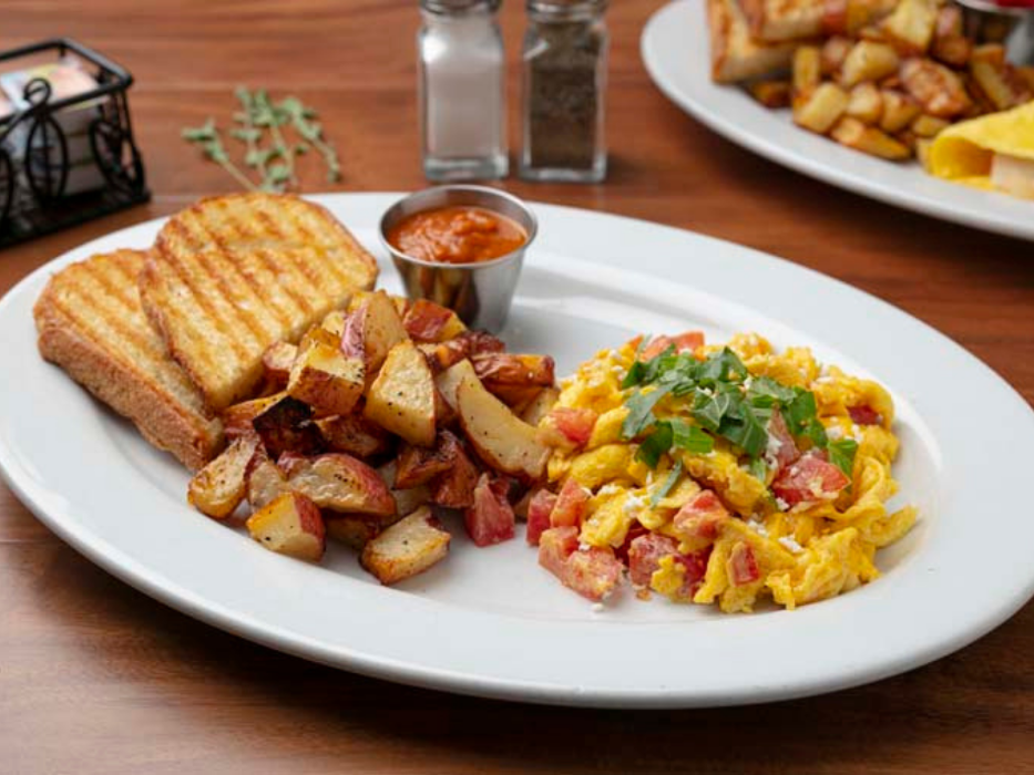 Create Your Own Scramble (Made with Brown Free Range Organic Eggs). Served with Artisan Toast and 1 Side.