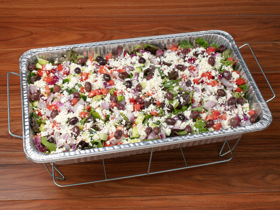 Mediterranean Greek Salad Catering Tray: mixed greens, feta cheese, diced tomatoes and cucumbers, and homemade balsamic dressing