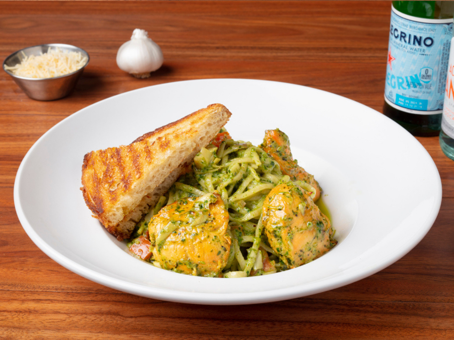 Chicken Pesto Linguine made with grilled chicken, fresh pesto, cream, tomatoes and garlic