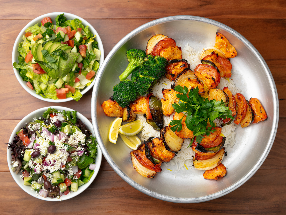 Kabobs Family Style: Dine-in only special with 3 skewers of chicken kabobs and rice alongside two bowls of salad. Feeds up to 4.
