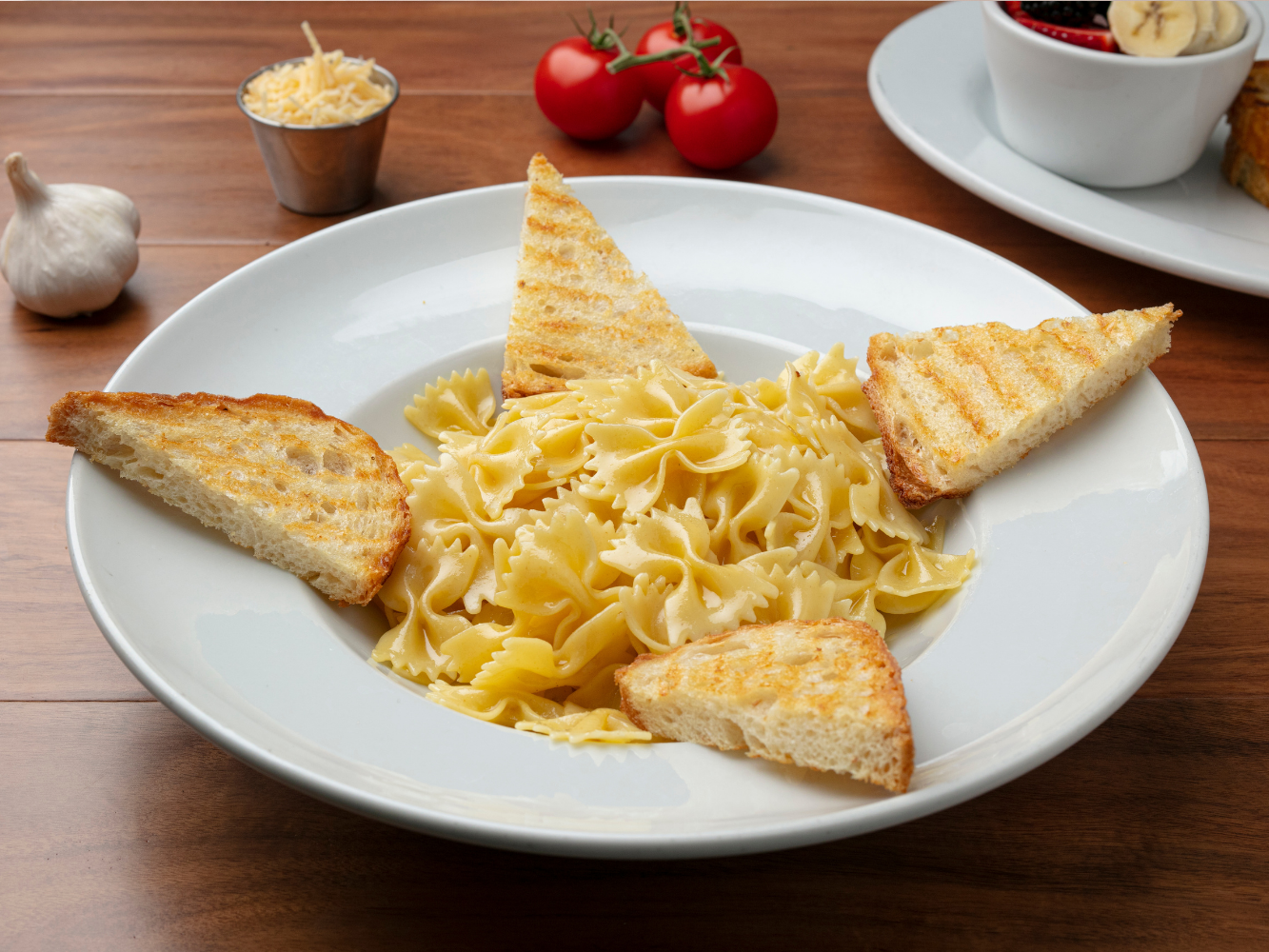 Kids Buttered Pasta: bowtie pasta, salted butter, parmesan cheese