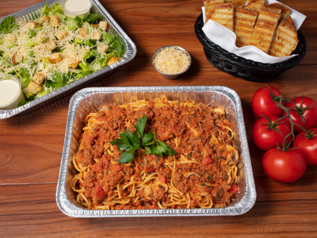 Family Pasta Combo (Linguine Bolognese): Feeds 4-6 and includes 1 pasta, 1 salad, and grilled artisan bread.