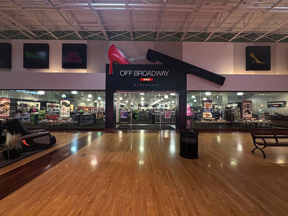 Off Broadway Shoe Warehouse Logo