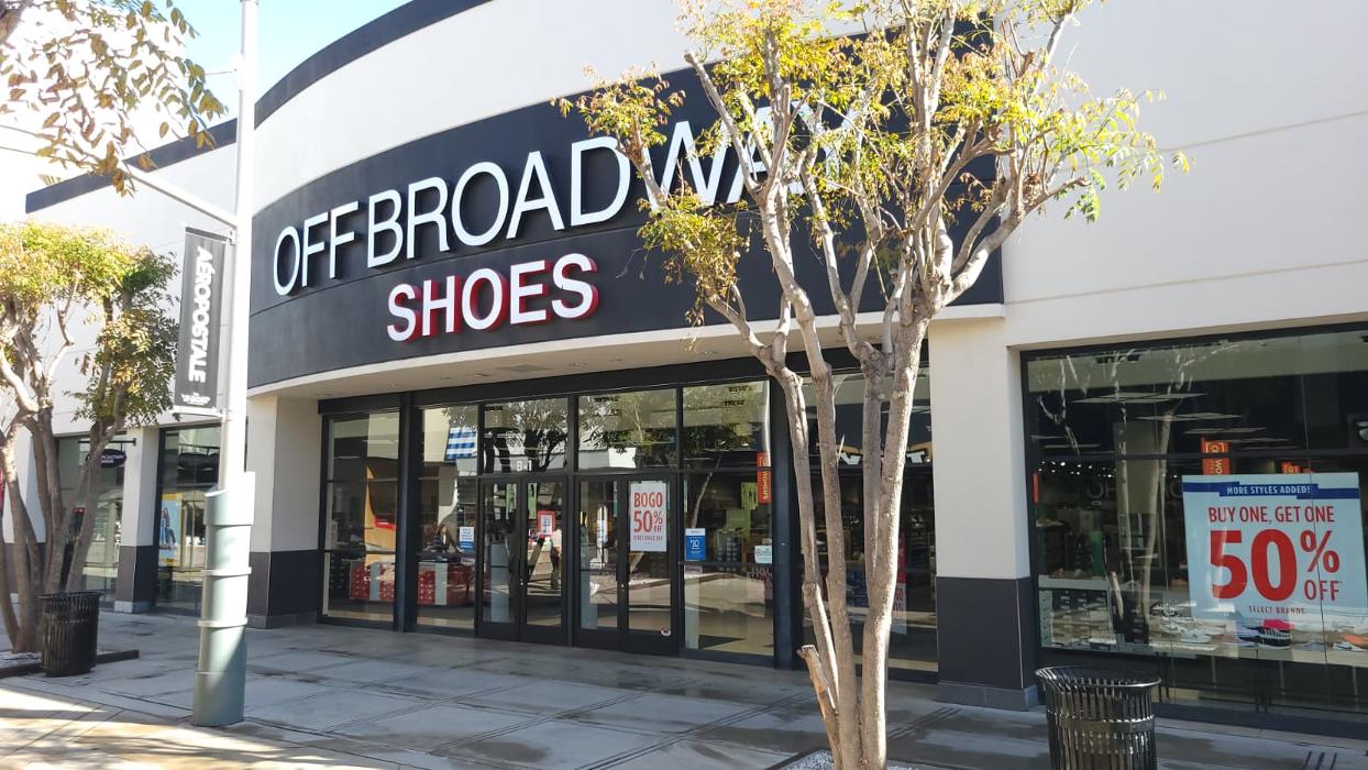 Off Broadway Shoe Warehouse Logo