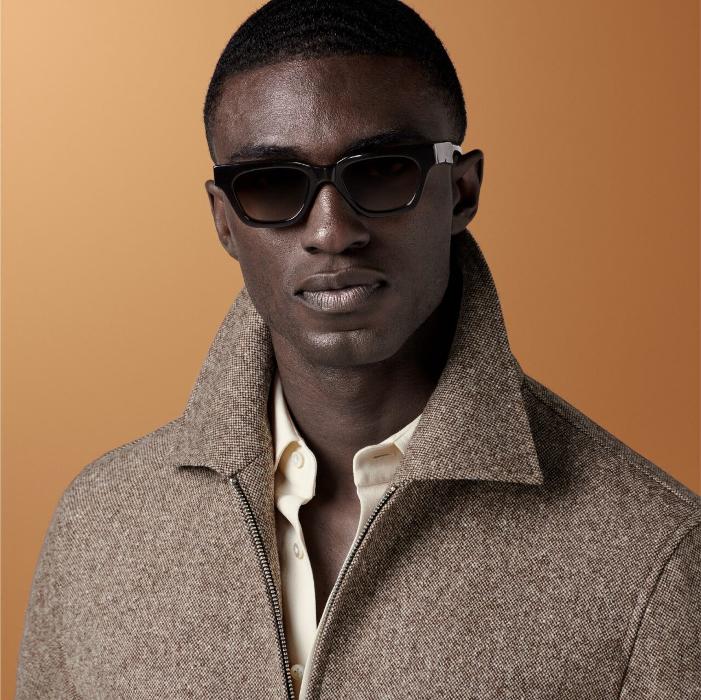 Brown bomber jacket featuring a straight collar, double-ended zip closure, and welted pockets. Designed with an elastic hem and cuffs for comfort, and includes practical inside pockets. Hip-length and fully lined.