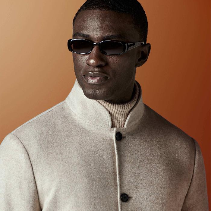 This light brown shirt-jacket is cut to a relaxed fit — easy through the chest and shoulders with a clean, unstructured silhouette — and features a stand collar, patch pockets, and a four-button fastening.