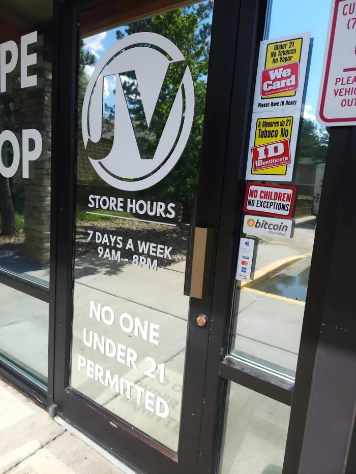 Exterior - Door with store hours