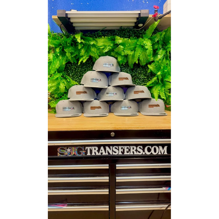 Custom branded hats with leather patches produced by SJG Print & Design in Austin, Texas.