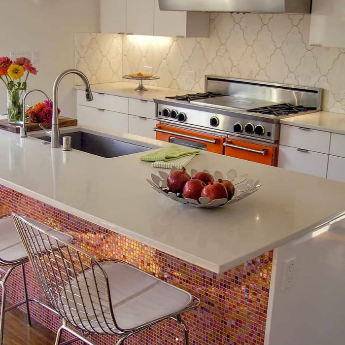 This modernist kitchen, illuminated by clerestory windows, combines bold design with functional elegancedefined by its open floor plan and dynamic entertaining space.