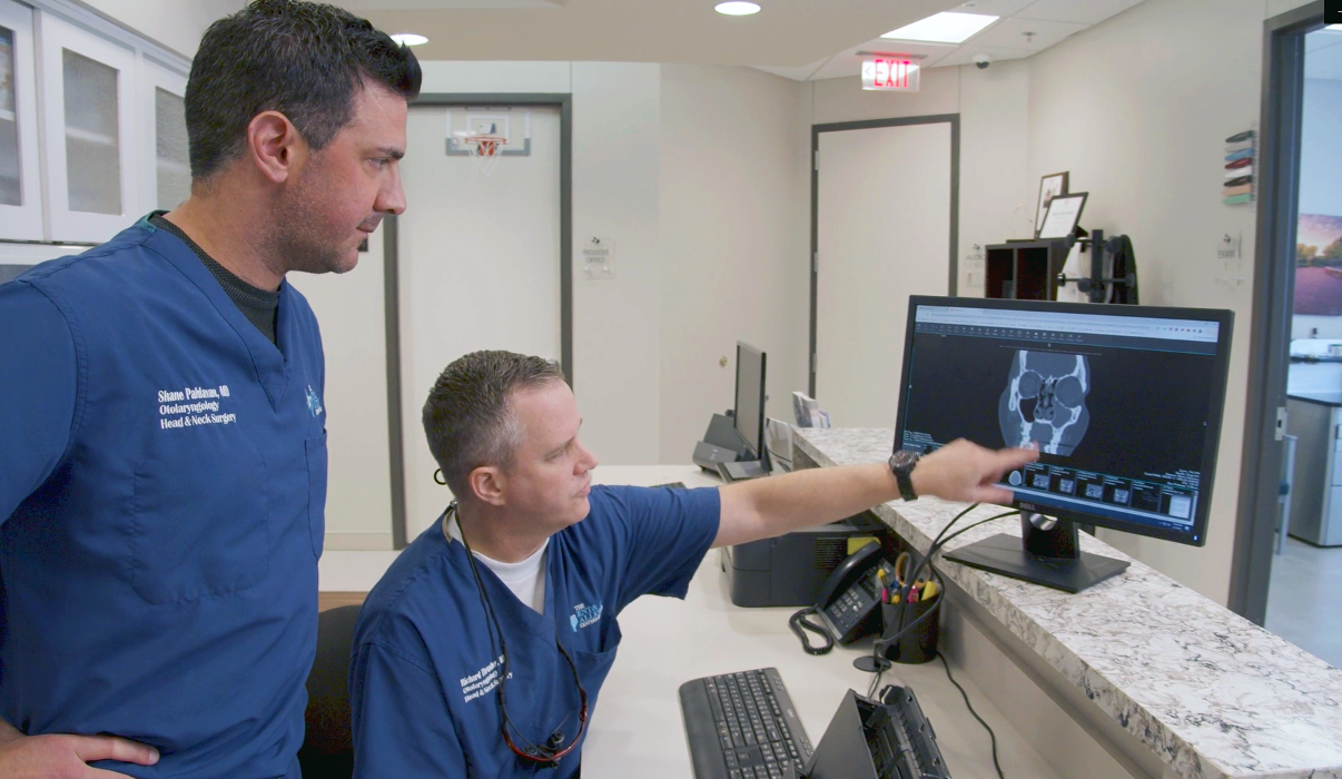 Richard Thrasher, MD, with Shane Pahlavan, MD, reviewing a patient's sinus imaging