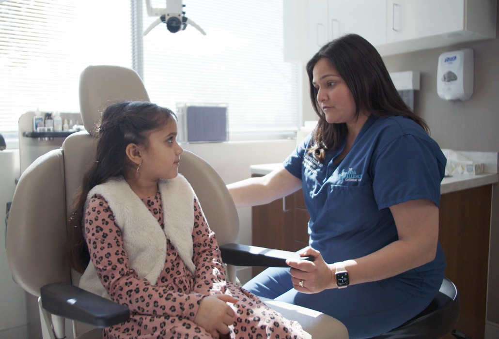 Sakeena Payne, MD, with a pediatric patient