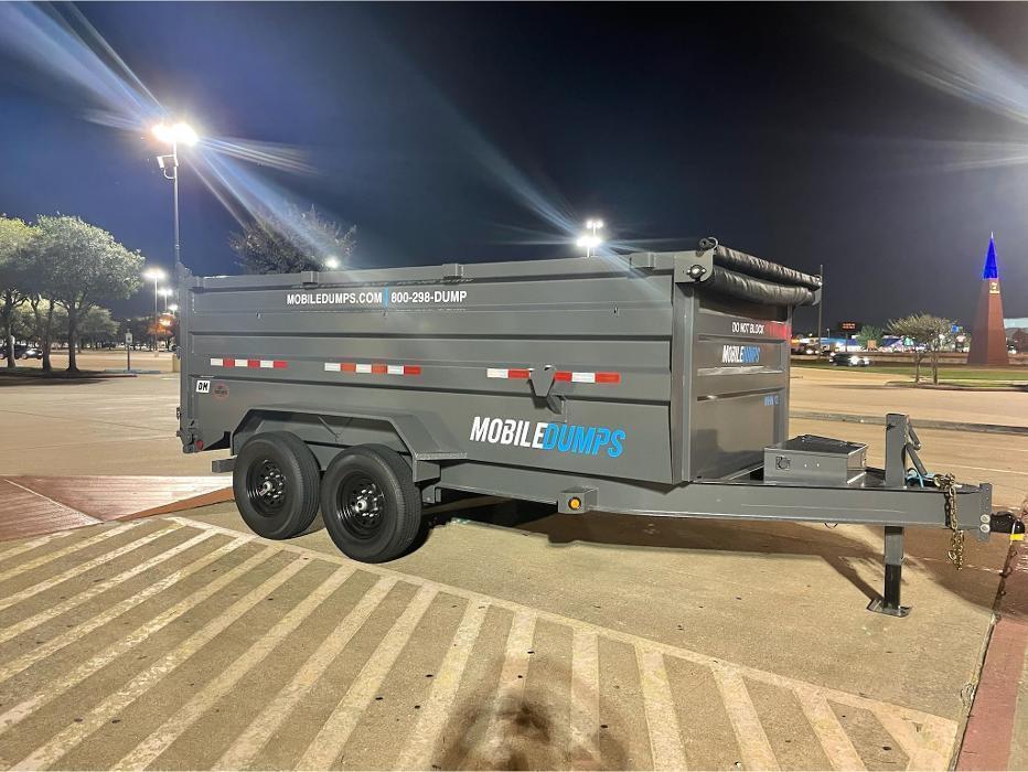 Mobiledumps Houston 14-yard mobile dumpster parked safely at a commercial parking lot. Ideal for night work, commercial cleanouts, and contractor debris removal.