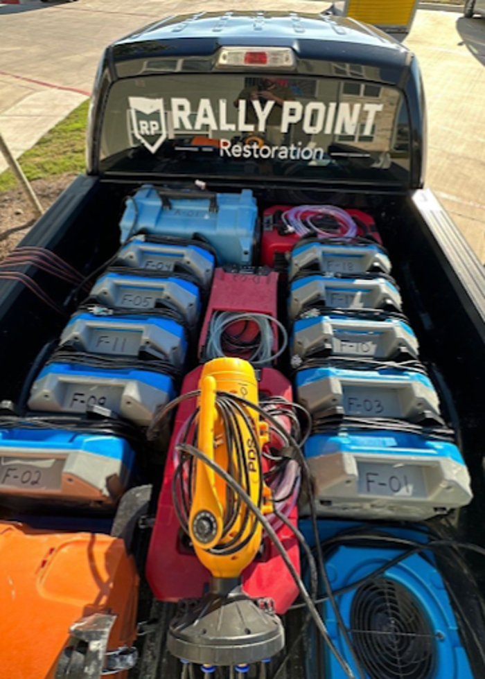 Truck Bed Loaded with Equipment. Rally Point Truck Loaded for Emergency Water Response. Fully stocked Rally Point truck with professional-grade air movers and dehumidifiers. Ready to respond 24/7 to water emergencies across Hays County.