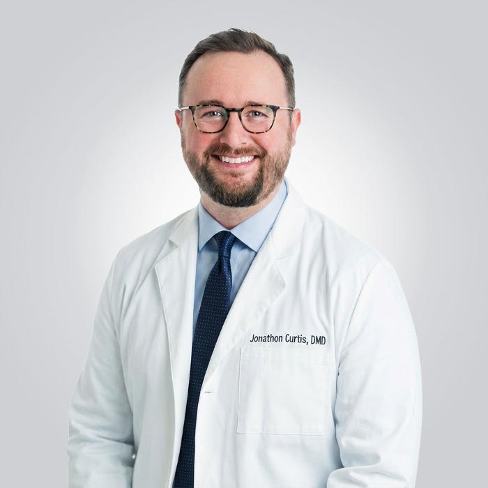 Jonathon Curtis, DDS, DMD Logo