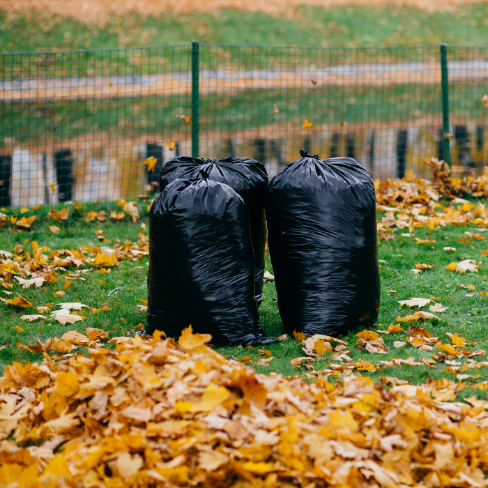 Garden waste bags filled after a tidy-up, demonstrating the waste removal and clean-up service included in many garden visits.