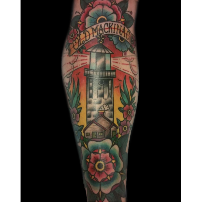 American traditional lighthouse tattoo by Cory. Bold lines, bright colors, and classic style.