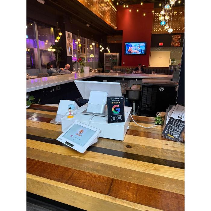 Clienity Tap in use at a restaurant location, making it simple for customers to tap and leave a Google review instantly.