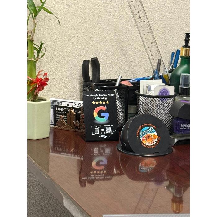 Clienity Tap NFC review stand placed inside a tax office, allowing clients to leave a Google review easily with a simple phone tap.