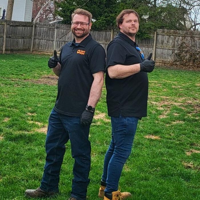 Your trusted Yard Ninjas team picking up pet waste and keeping your lawn fresh and deodorized one yard at a time.