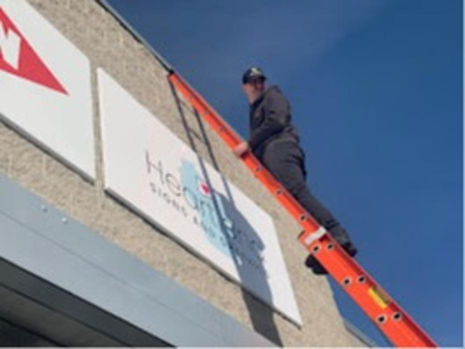storefront location putting up sign