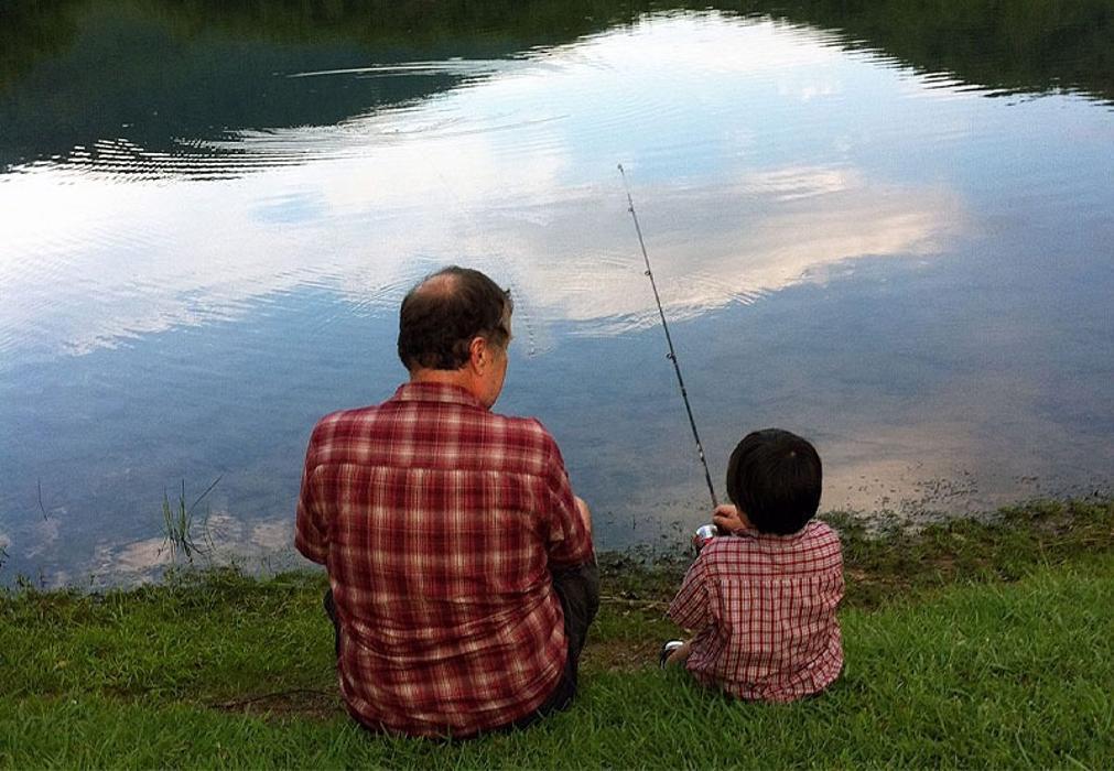 Grandpa and grandson fishing on Lake Tamarack in Bent Tree