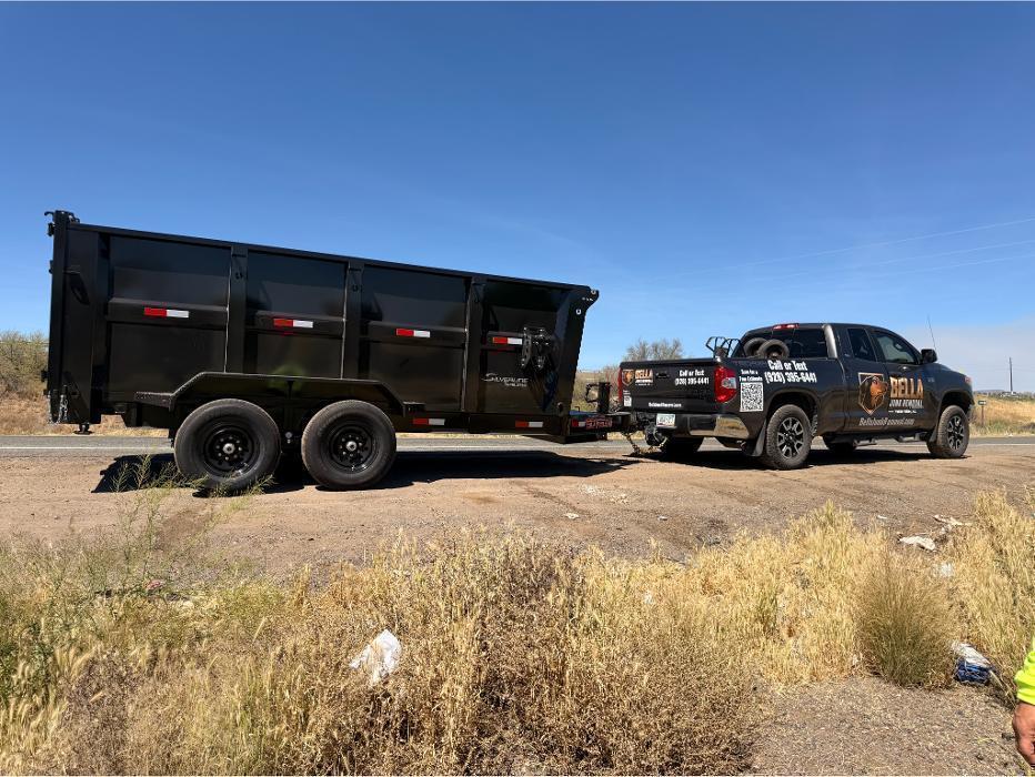 Bella Junk Removal's Toyota Tundra with the 14-foot dump trailer ready for service.