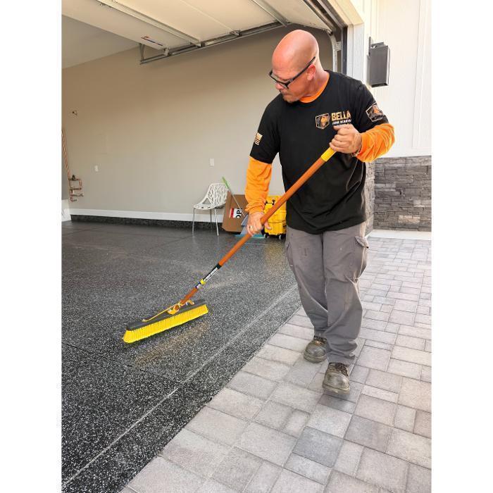 Robert sweeping up after a construction debris pickup job.