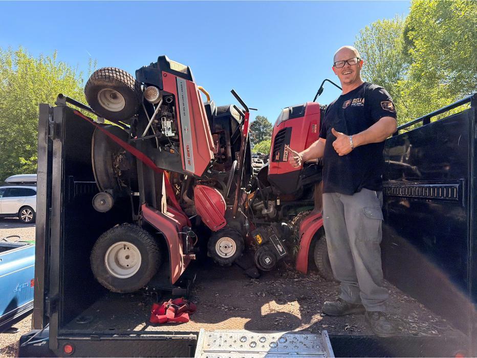 Robert after loading over 4,000 lbs of riding mowers and metal equipment into our F-550 dump truck.