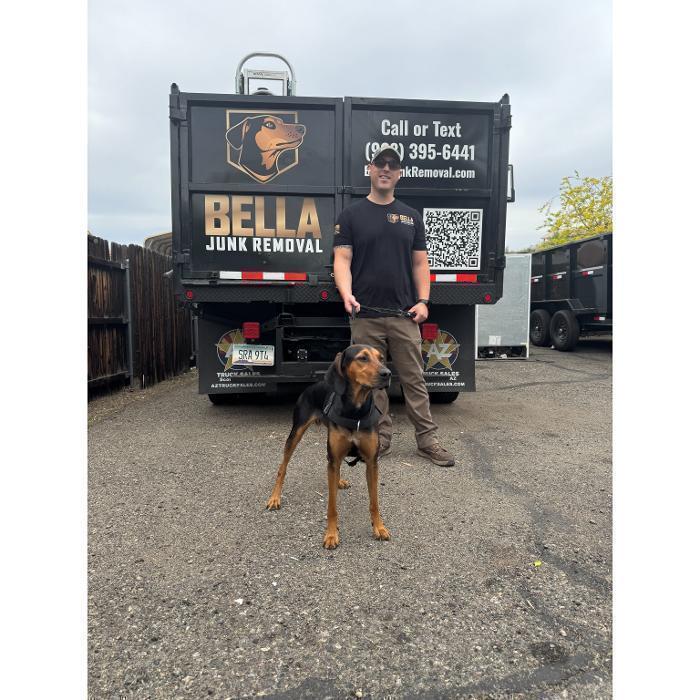 Bella Junk Removal owner Nate Seeley with Bella, the company's namesake.