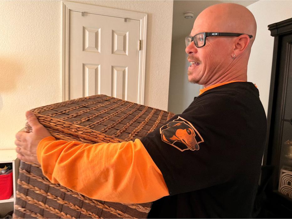Robert is removing miscellaneous junk from a house.