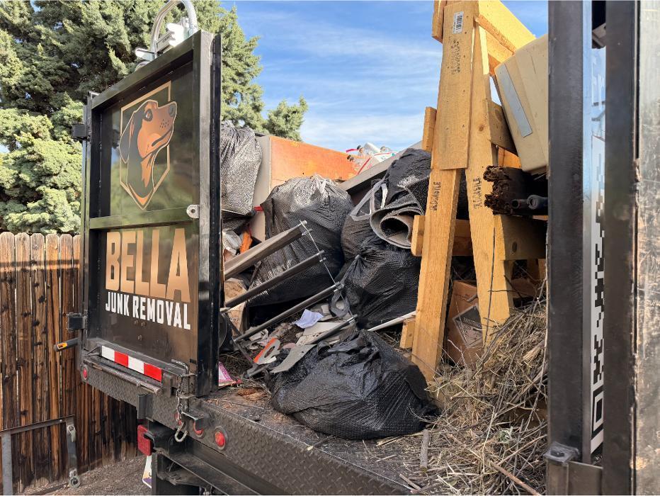 Bella Junk Removal dump truck loaded with junk after a cleanout job in the Verde Valley.