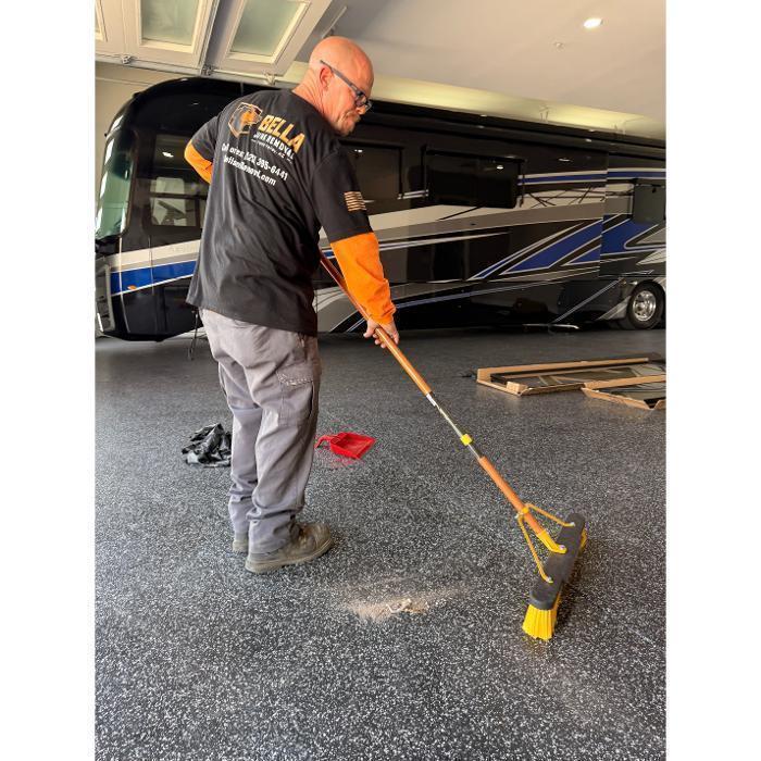 Robber sweeping after a junk removal job.