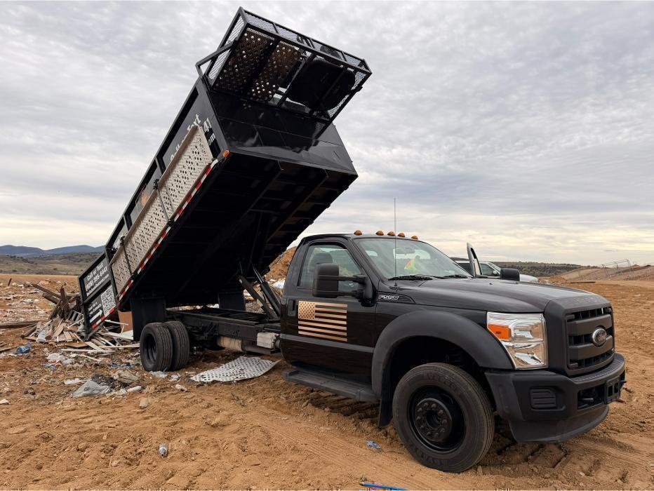 The Bella Junk Removal Truck dumping at the landfill.